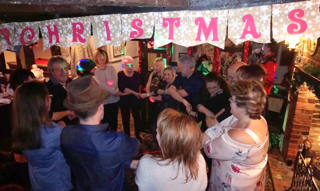 People Celebrating New Year at The Chequers in Roxwell singing Auld Lang Syne